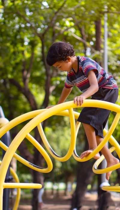 asian-boy-is-climbing-playground-equipment-school