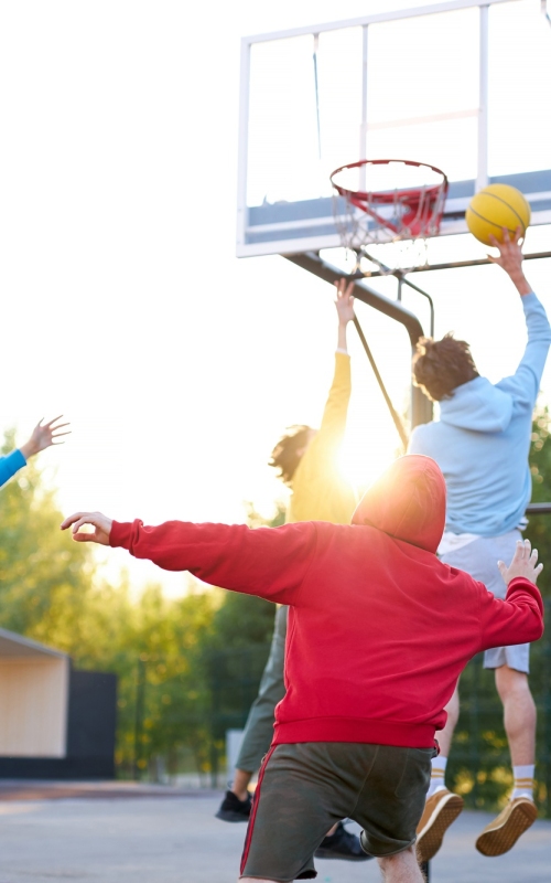 slam-dunk-young-caucasian-basketball-players-boys-throwing-ball-into-basketball-hoop